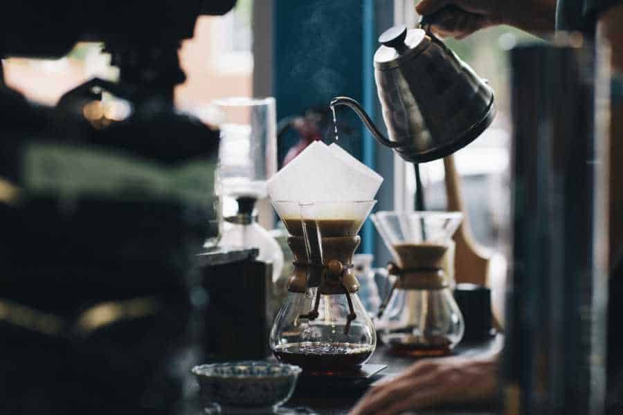 Hot coffee being poured from pot