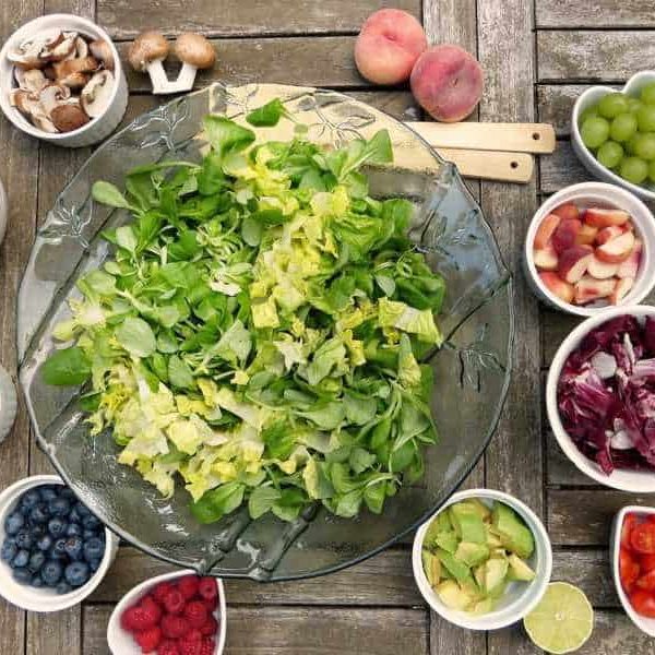 Salad in a glass bowl with various toppings for vegan and vegetarian meals in San Marcos Texas