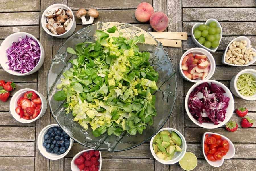 Salad in a glass bowl with various toppings for vegan and vegetarian meals in San Marcos Texas