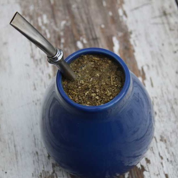 Traditional blue serving gourd and straw for yerba mate