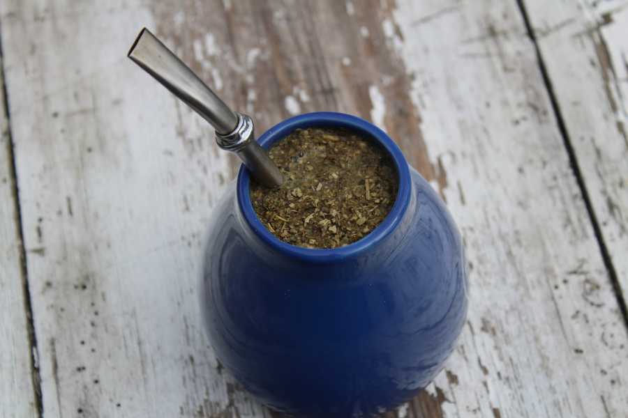 Traditional blue serving gourd and straw for yerba mate