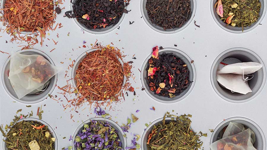 A colorful selection of herbal teas are laid out side-by-side.