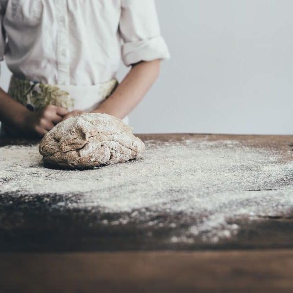 Baker preparing bread dough