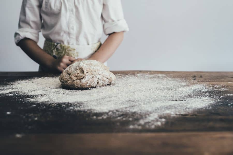 Baker preparing bread dough