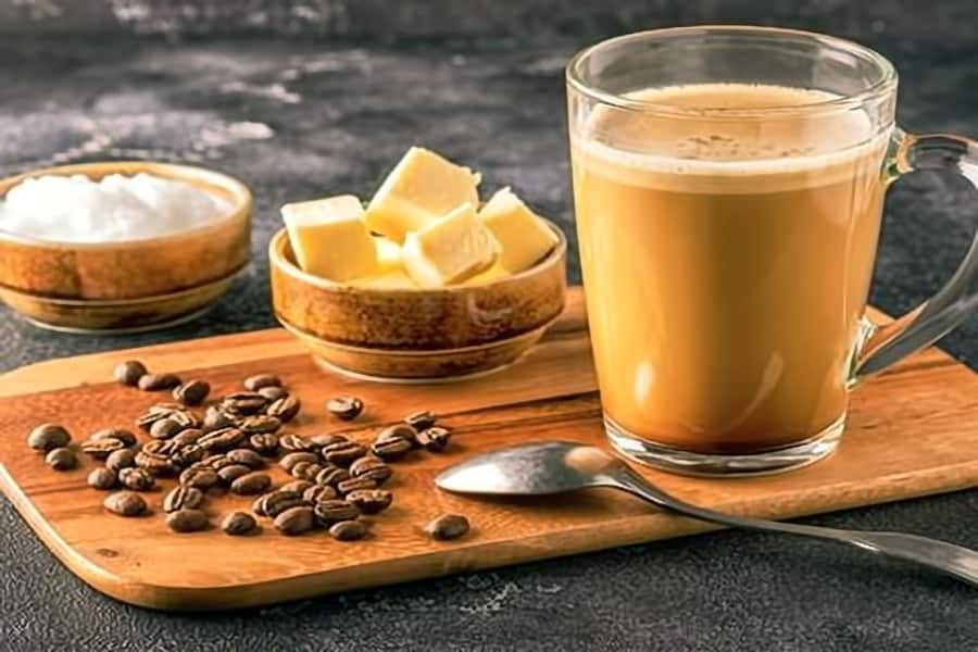 Bulletproof coffee sitting on table - San Marcos coffee shop