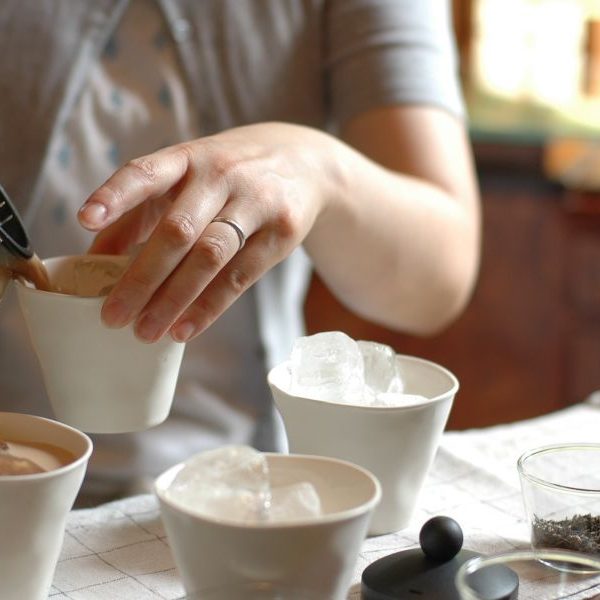 Person pouring chai tea