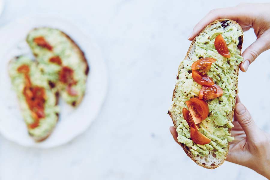 Avocado toast with roasted cherry tomatoes at vegan Breakfast restaurants in San Marcos, Tx that also serve coffee