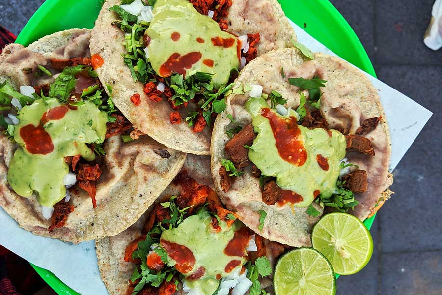 Chickpea & tofu tacos topped with cilantro and salsa