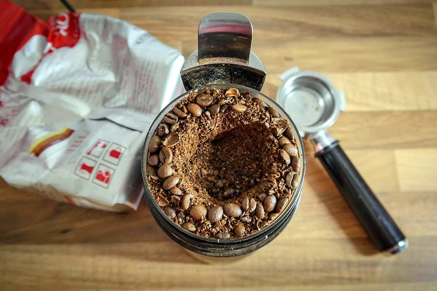 Coffee beans in a food processor from a coffee in Frisco TX