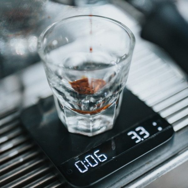 Coffee being weighed on a scale