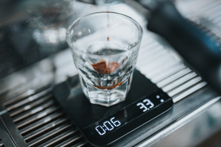 Coffee being weighed on a scale