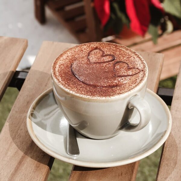 Frisco TX Chocolate coffee in a cute cup with heart smiley face drawn in chocolate on it