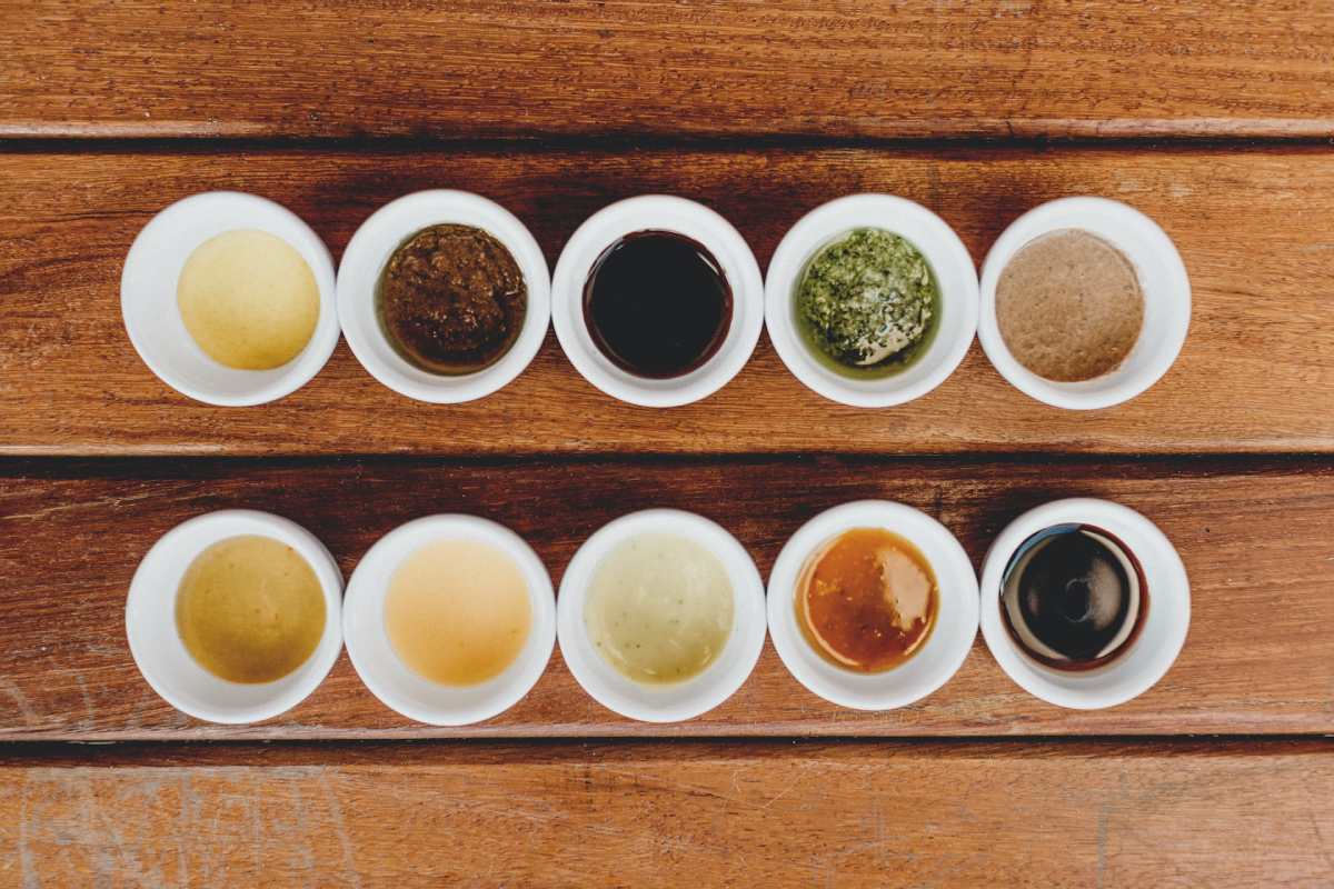 Flat-lay photography of a variety of different teas in cups arranged into a grid