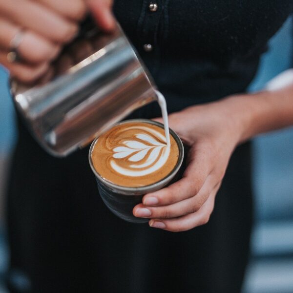 barista pouring latte art