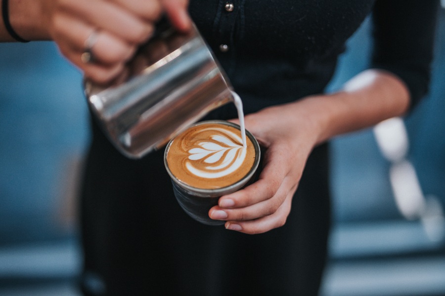 barista pouring latte art