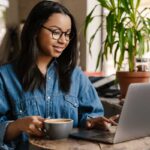 Woman studying remote from a coffee shop