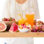 A person showing a healthy meal made with fresh fruits.