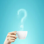 Hand holding a white teacup with steam rising from it to form a distinct question mark against a vibrant teal background.