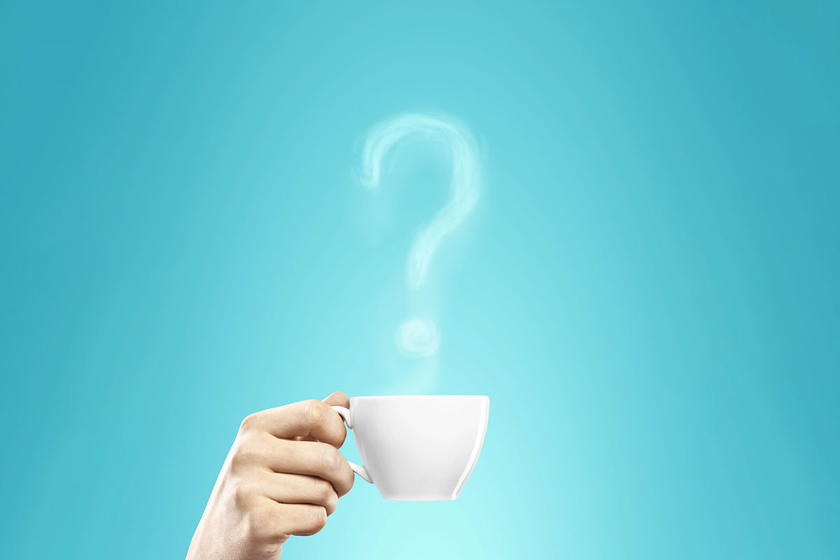 Hand holding a white teacup with steam rising from it to form a distinct question mark against a vibrant teal background.